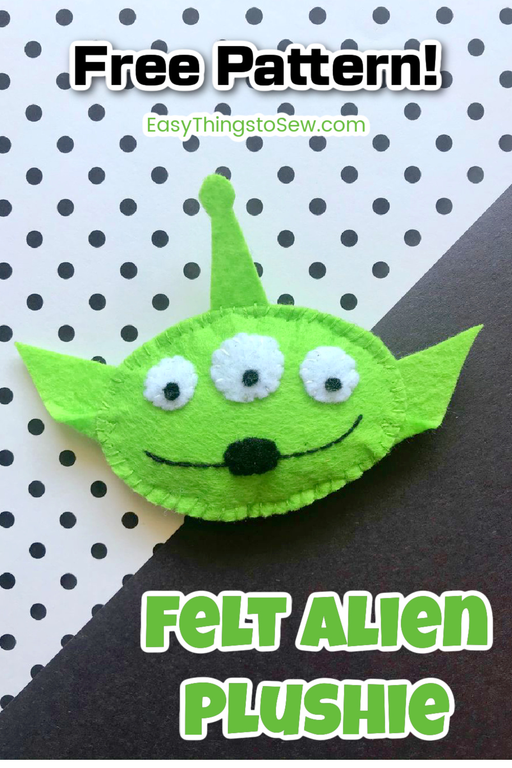 felt alien plushie on white and black background